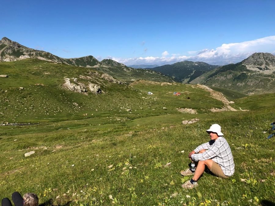 Ludolf sitting in the mountains overlooking the Balkan highlands